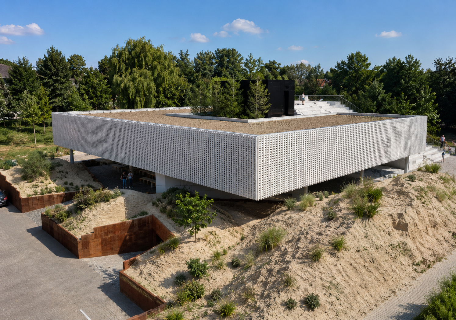 Campus universitaire contemporain conçu par Loyd Architects, mêlant architecture minimaliste et intégration paysagère avec façades perforées blanches, toiture accessible végétalisée et espaces de rencontre ouverts sur un environnement naturel.